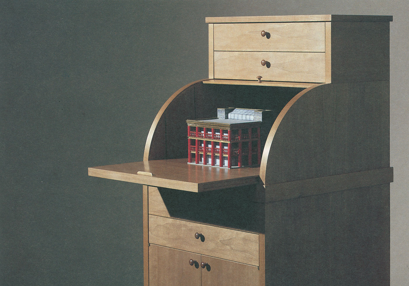 Carteggio (1987) is a tall, narrow, tower-like piece of furniture, completed at the top with a roll-up compartment.